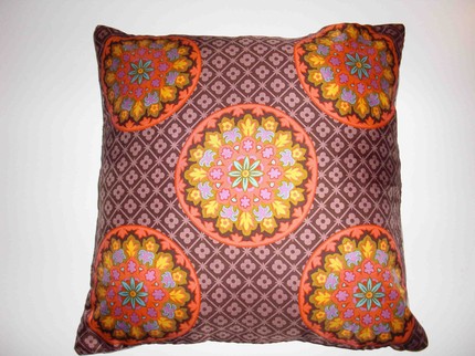 Buy a scarf pillow, like this Mod Floral Medallion Scarf Pillow ($25), or create one out of two vintage scarves.
Buy a scarf pillow, like this Mod Floral Medallion Scarf Pillow ($25), or create one out of two vintage scarves.