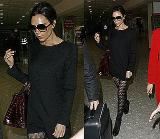 Victoria Beckham at Airport Wearing Black Sweater Dress, Patterned Tights, and Red Crocodile Bag