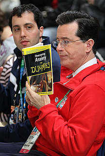 Photo of Stephen Colbert Reading Anxiety For Dummies at Olympics