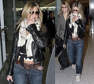 Photos of Jennifer Aniston Wearing a Black Leather Jacket and Scarf Arriving at Heathrow Airport in London