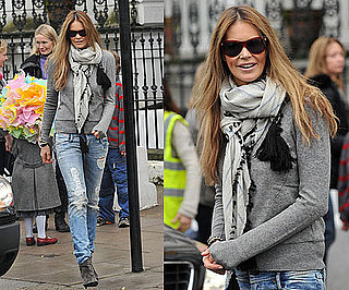 Elle Macpherson in London Wearing Ripped Jeans and Gray Boots