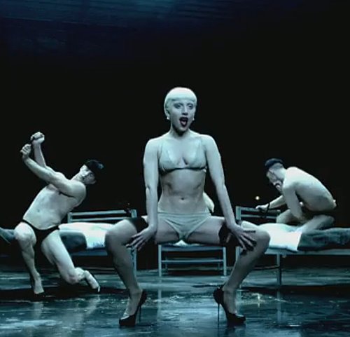 Gaga does a dance number in nude underthings and thigh-high stockings. Dirty sexy. And that bed dancing — yowza!
Gaga does a dance number in nude underthings and thigh-high stockings. Dirty sexy. And that bed dancing — yowza!