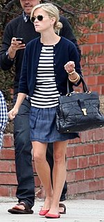 Reese Witherspoon Wearing a Denim Skirt and Ray Ban Aviators