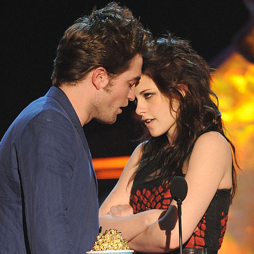 Sparks flew at the May 2009 MTV Movie Awards in LA when Robert Pattinson and Kristen Stewart accepted their best kiss award and came close to locking lips on stage.
Sparks flew at the May 2009 MTV Movie Awards in LA when Robert Pattinson and Kristen Stewart accepted their best kiss award and came close to locking lips on stage.
