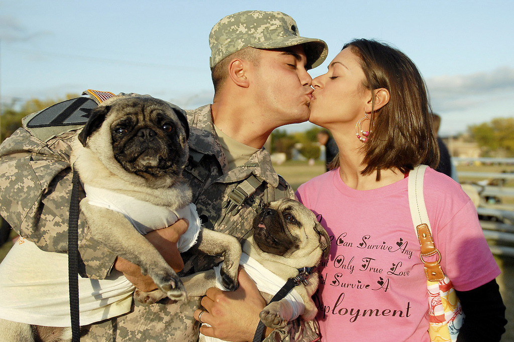Army Spc. Leo Leroy gets a kiss from Regina Leroy and maybe some licks from dogs Yoshi and Bruiser at Fort Hood, Texas, on Nov. 28, 2009.
Army Spc. Leo Leroy gets a kiss from Regina Leroy and maybe some licks from dogs Yoshi and Bruiser at Fort Hood, Texas, on Nov. 28, 2009.