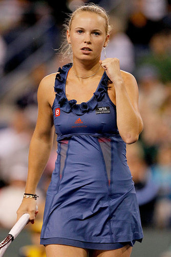 Caroline Wozniacki debuted Adidas by Stella McCartney Tennis Ruffle Dress in blue for the opening match at Indian Wells in 2011.
Caroline Wozniacki debuted Adidas by Stella McCartney Tennis Ruffle Dress in blue for the opening match at Indian Wells in 2011.