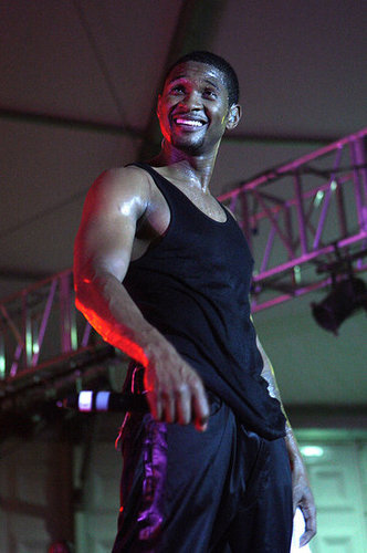 Usher beat the Summer heat in a tight black tank top while performing at the Thisday Africa Rising Festival in July 2008.
Usher beat the Summer heat in a tight black tank top while performing at the Thisday Africa Rising Festival in July 2008.