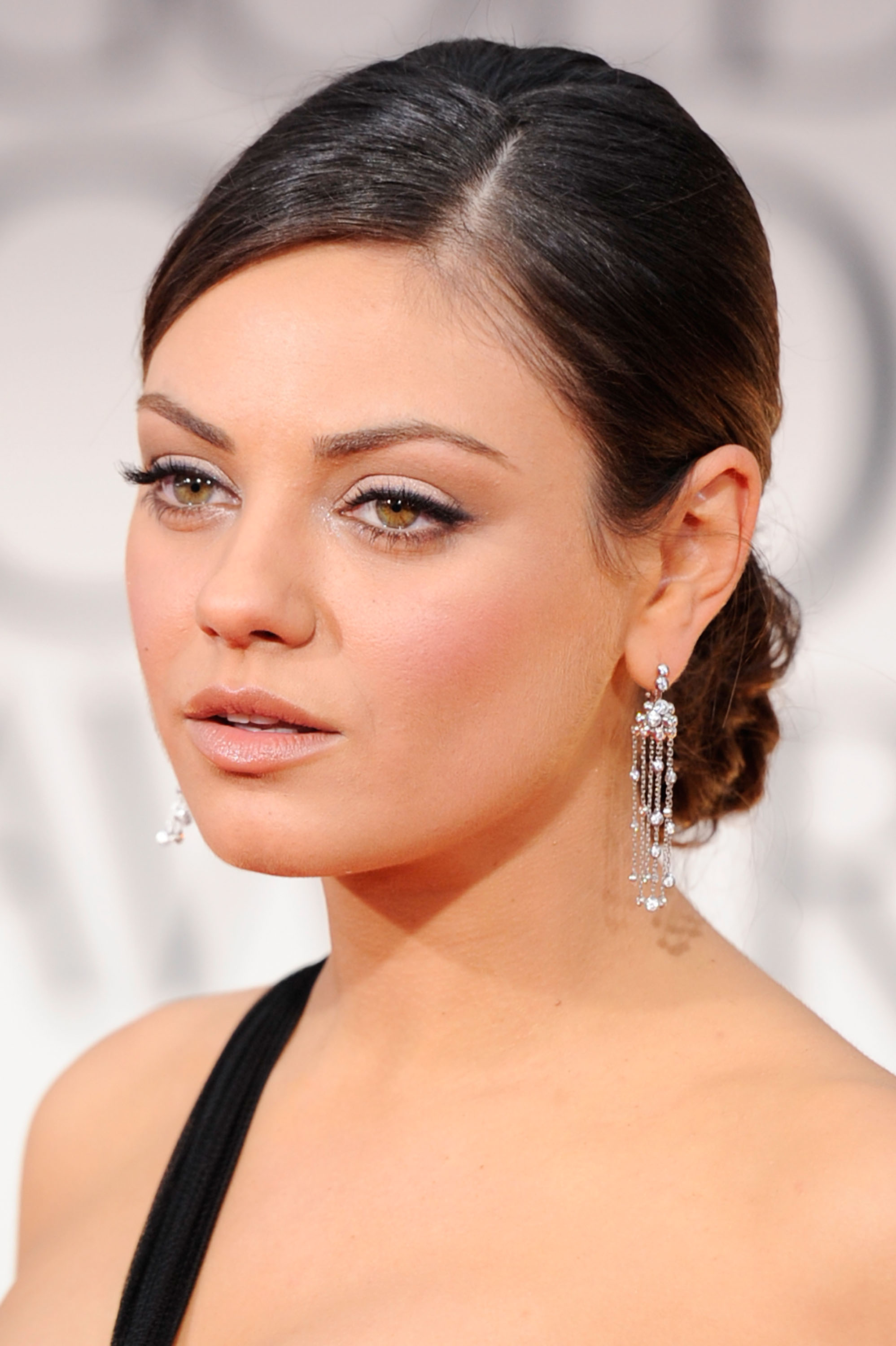 Mila Kunis at the Golden Globes. Mila Kunis at the Golden Globes.