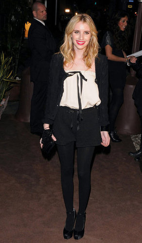 Emma punched up her menswear-inspired Chanel style with a red lip for an LA event in 2011.
Emma punched up her menswear-inspired Chanel style with a red lip for an LA event in 2011.