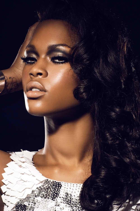 Model with extreme eyeliner and nude lips