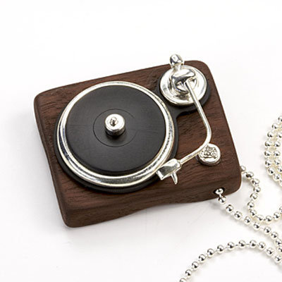 Real vinyl and sterling silver turntable pendant ($462)
Real vinyl and sterling silver turntable pendant ($462)