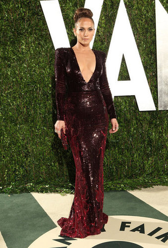 Later in the evening, Jennifer Lopez slipped into a dark crimson Zuhair Murad sequined gown showed off a daring amount of decolletage.
Later in the evening, Jennifer Lopez slipped into a dark crimson Zuhair Murad sequined gown showed off a daring amount of decolletage.