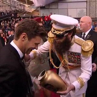 Sacha Baron Cohen as The Dictator Spilling Ashes on Ryan Seacrest at 2012 Oscars Video