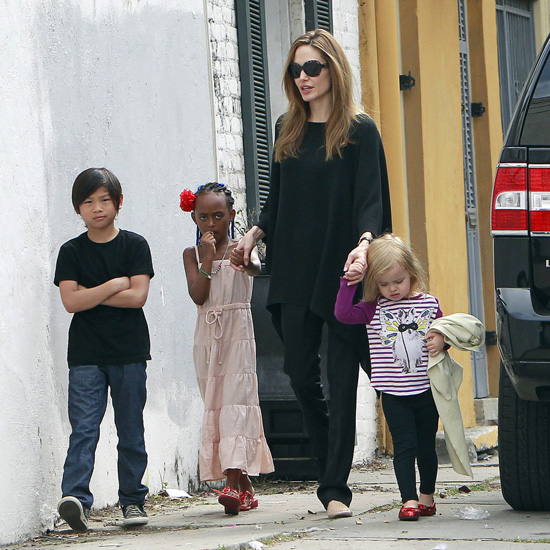 Angelina Jolie was in mommy mode as she ventured out with half of her brood in New Orleans on Sunday (March 11).