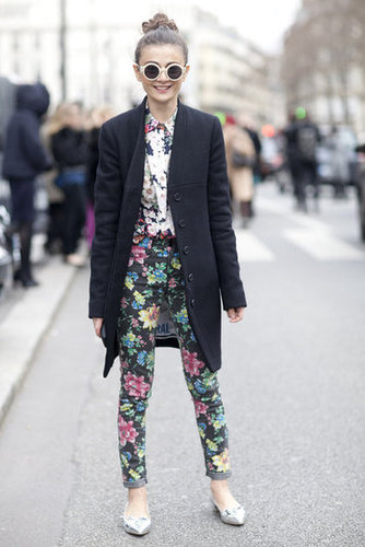 A black coat anchors floral on floral.
A black coat anchors floral on floral.