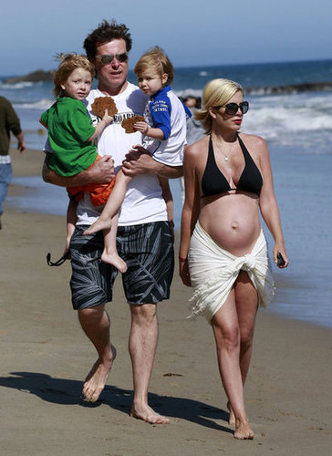 Tori Spelling was spotted taking a walk on the beach with her family while pregnant with baby Hattie. The now-mama-of-four has said she's proud to show off her baby belly in a bikini.
Tori Spelling was spotted taking a walk on the beach with her family while pregnant with baby Hattie. The now-mama-of-four has said she's proud to show off her baby belly in a bikini.