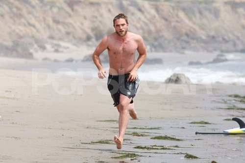 Robert Pattinson ran on the beach shirtless.
Robert Pattinson ran on the beach shirtless.
