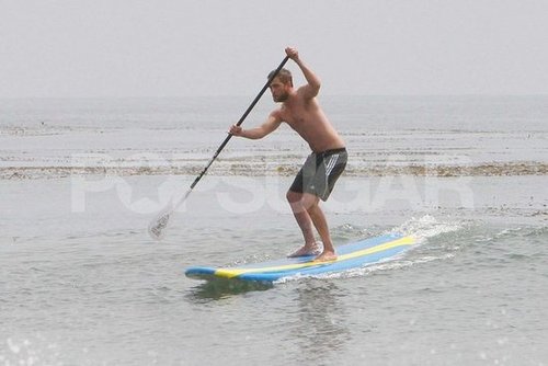 Robert Pattinson surfed shirtless on his paddleboard.
Robert Pattinson surfed shirtless on his paddleboard.