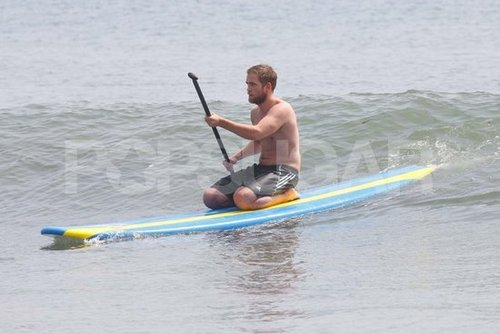 Robert Pattinson sat down on his paddleboard.
Robert Pattinson sat down on his paddleboard.