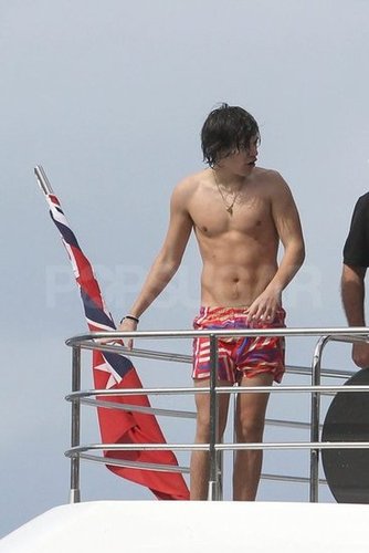 One Direction's Harry Styles showed off his abs while hanging out in Australia.
One Direction's Harry Styles showed off his abs while hanging out in Australia.