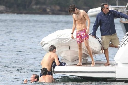 One Direction members spent their time in Australia boating and swimming.
One Direction members spent their time in Australia boating and swimming.