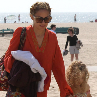 Nicole Richie Wears Orange Winter Kate Top in Malibu