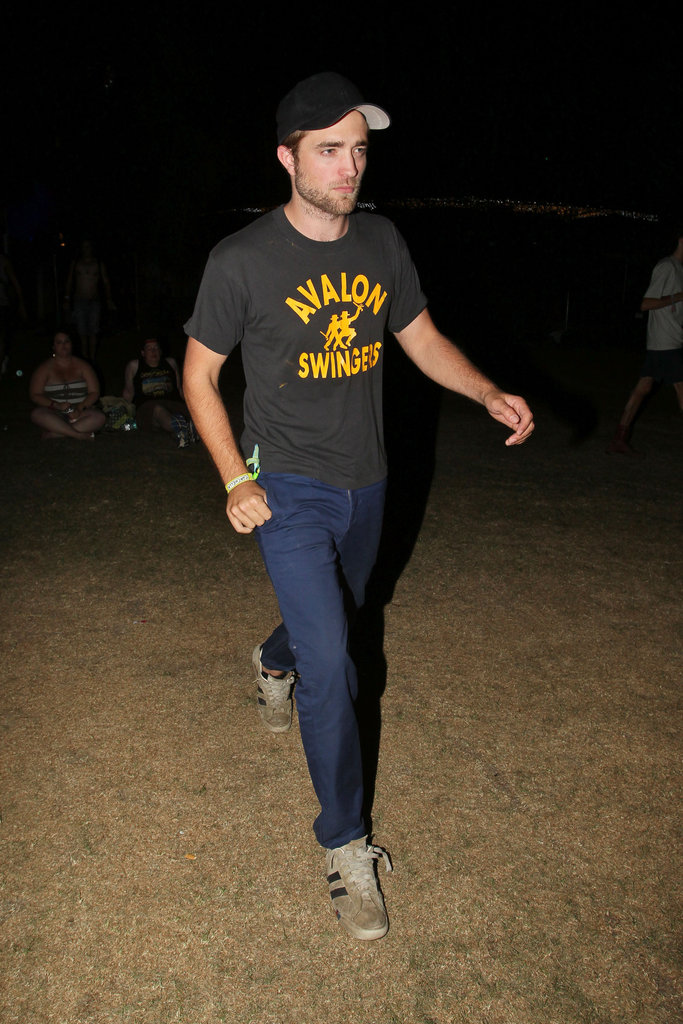 Robert Pattinson wore a black t-shirt and hat to 2012 Coachella's second weekend.
Robert Pattinson wore a black t-shirt and hat to 2012 Coachella's second weekend.