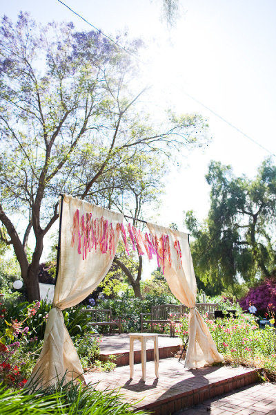 Set the stage with tall curtains in a neutral shade; then hang a ribbon garland that goes with your color palette.
Photo by Mr. Haack via Style Me Pretty
Set the stage with tall curtains in a neutral shade; then hang a ribbon garland that goes with your color palette.
Photo by Mr. Haack via Style Me Pretty