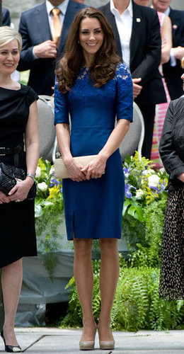 Another shot of Kate Middleton in her lacy blue Erdem dress, nude pumps, and a long nude clutch.
Another shot of Kate Middleton in her lacy blue Erdem dress, nude pumps, and a long nude clutch.