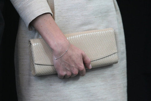 She paired her By Malene Birger linen dress with a snakeskin-textured long clutch.
She paired her By Malene Birger linen dress with a snakeskin-textured long clutch.