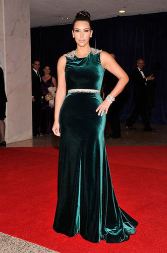 Kim Kardashian showed off her curved in a dark green dress.
Kim Kardashian showed off her curved in a dark green dress.