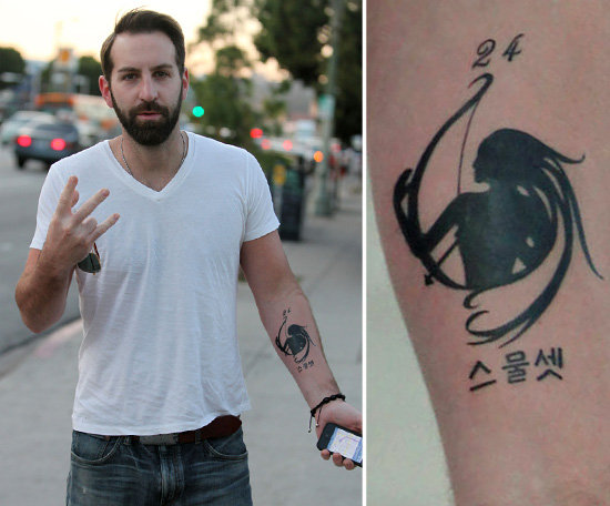 Josh Kelley put a lot of thought into his forearm tattoo. He tweeted about the ink in November 2011 saying, "My wife's b-day is Nov 24 and Naleigh's is on Nov 23 so her 23 is in Korean and the sagittarius symbol in the middle." Josh had the work done at LA's Studio City Tattoo.
Josh Kelley put a lot of thought into his forearm tattoo. He tweeted about the ink in November 2011 saying, "My wife's b-day is Nov 24 and Naleigh's is on Nov 23 so her 23 is in Korean and the sagittarius symbol in the middle." Josh had the work done at LA's Studio City Tattoo.