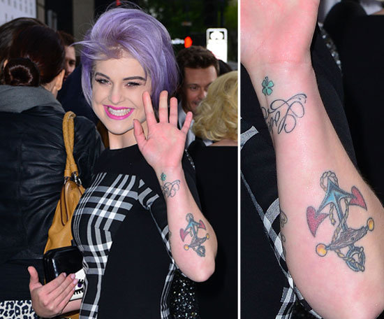 Kelly Osbourne has multiple tattoos on her left arm including an anchor and script.
Kelly Osbourne has multiple tattoos on her left arm including an anchor and script.