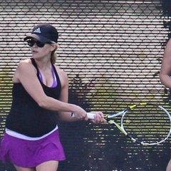 Reese Witherspoon Playing Tennis in Purple Skirt