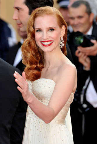 Jessica exudes Old Hollywood glamour in her embellished ivory Giorgio Armani gown and Chopard earrings.
Jessica exudes Old Hollywood glamour in her embellished ivory Giorgio Armani gown and Chopard earrings.