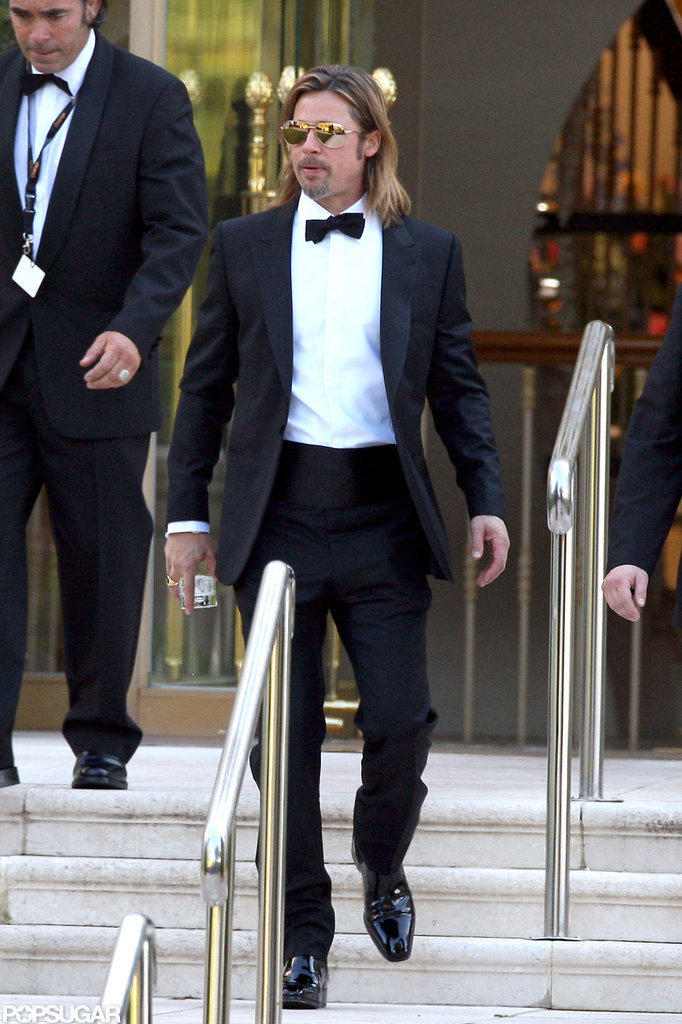 Brad Pitt carried a drink outside the Eden Roc Hotel. Brad Pitt carried a drink outside the Eden Roc Hotel.