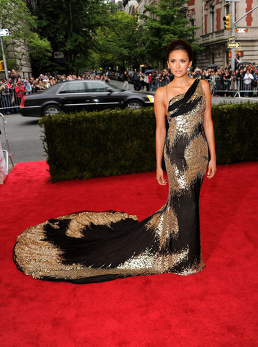 She attended the 2012 Met Gala in an eye-catching liquid black-and-gold Donna Karan Atelier gown — just look at that train!
She attended the 2012 Met Gala in an eye-catching liquid black-and-gold Donna Karan Atelier gown — just look at that train!