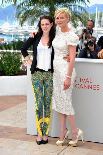 Talk about a fashionable duo — Kristen Stewart and Kirsten Dunst strike a pose at the On the Road photocall. Kristen dressed up her Rebecca Minkoff blazer with a pair of bright printed Balenciaga pants and black pumps. Kirsten wowed in a white laser-cut floral frock by Dolce & Gabbana, and to finish, she wore Charlotte Olympia pumps.
Talk about a fashionable duo — Kristen Stewart and Kirsten Dunst strike a pose at the On the Road photocall. Kristen dressed up her Rebecca Minkoff blazer with a pair of bright printed Balenciaga pants and black pumps. Kirsten wowed in a white laser-cut floral frock by Dolce & Gabbana, and to finish, she wore Charlotte Olympia pumps.