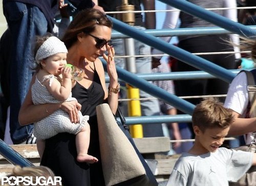 Victoria Beckham carried daughter Harper Beckham with son Romeo Beckham.
Victoria Beckham carried daughter Harper Beckham with son Romeo Beckham.