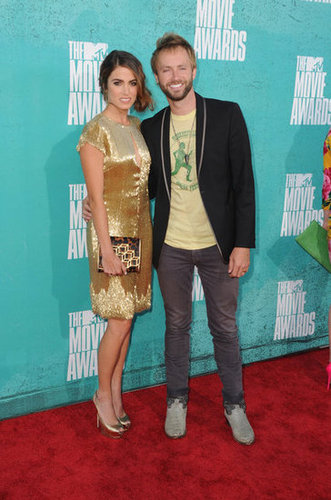 Nikki Reed wore a gold dress and posed with husband Paul McDonald on the red carpet at the MTV Movie Awards.
Nikki Reed wore a gold dress and posed with husband Paul McDonald on the red carpet at the MTV Movie Awards.