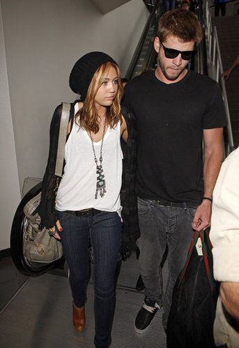 Miley Cyrus and Liam Hemsworth stuck together at LAX in June 2010.
Miley Cyrus and Liam Hemsworth stuck together at LAX in June 2010.
