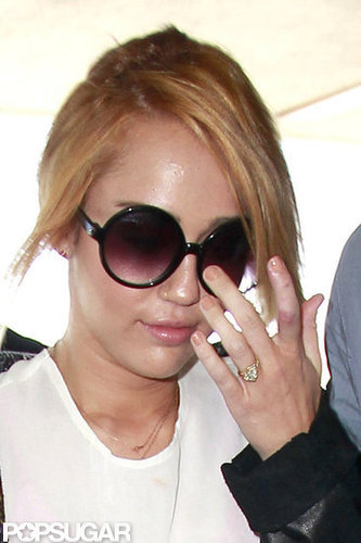 Miley Cyrus wore her engagement ring during her travels at LAX.
Miley Cyrus wore her engagement ring during her travels at LAX.