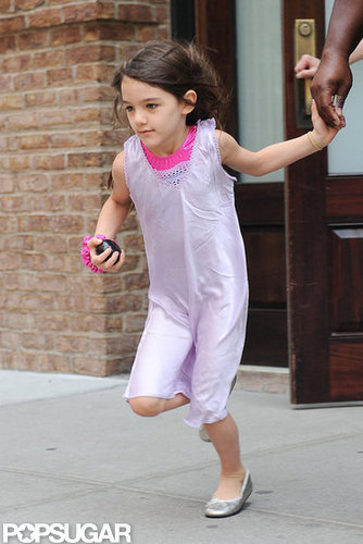 Suri Cruise looked cute in a purple dress.
Suri Cruise looked cute in a purple dress.
