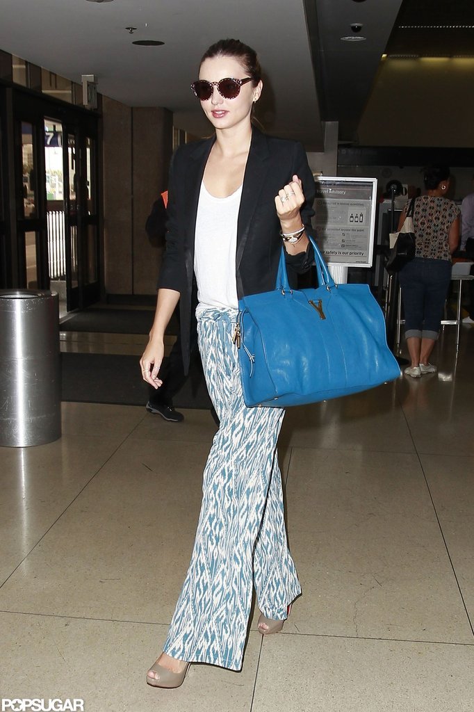 Miranda Kerr sported printed pants and shades at LAX. Miranda Kerr sported printed pants and shades at LAX.