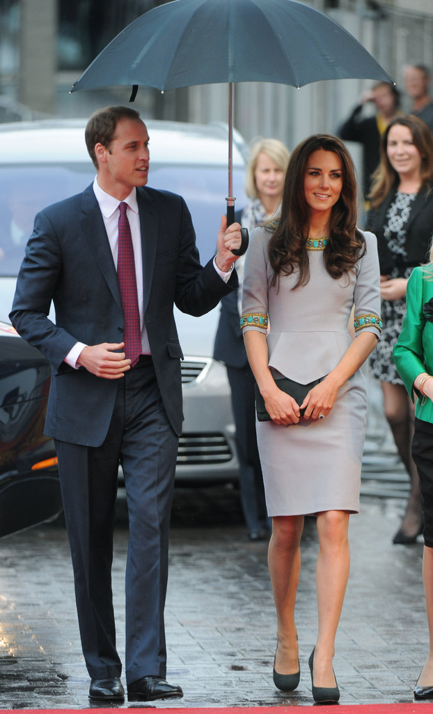 William held an umbrella over Kate's head while heading into a London theater in April 2012.
William held an umbrella over Kate's head while heading into a London theater in April 2012.