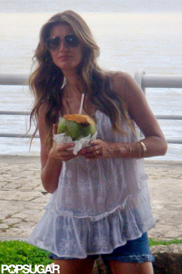Gisele Bundchen drank coconut water at a photo shoot in Brazil. Gisele Bundchen drank coconut water at a photo shoot in Brazil.