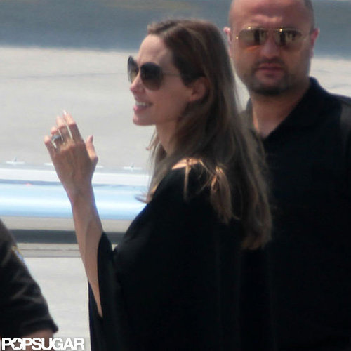 Angelina Jolie showed off her engagement ring leaving Bosnia.
Angelina Jolie showed off her engagement ring leaving Bosnia.