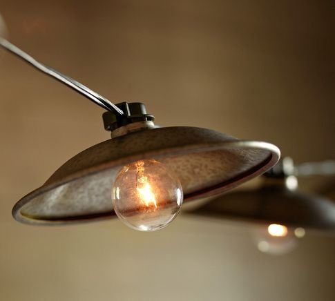 Cafe String Lights ($40) are topped with iron caps for a rustic look.
Cafe String Lights ($40) are topped with iron caps for a rustic look.