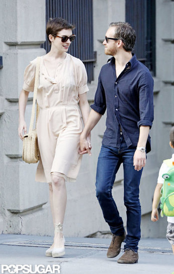 Anne Hathaway held hands with her fiancé. Anne Hathaway held hands with her fiancé.