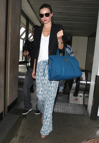 If only our airport looks were half this chic — Miranda capitalized on the pajama-pant trend in a pair of breezy, printed trousers, which she balanced with more polished pieces up top.
If only our airport looks were half this chic — Miranda capitalized on the pajama-pant trend in a pair of breezy, printed trousers, which she balanced with more polished pieces up top.